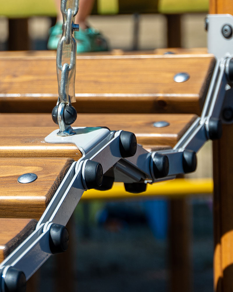 Close up of wooden wobbly brindge on UniPlay playground units.